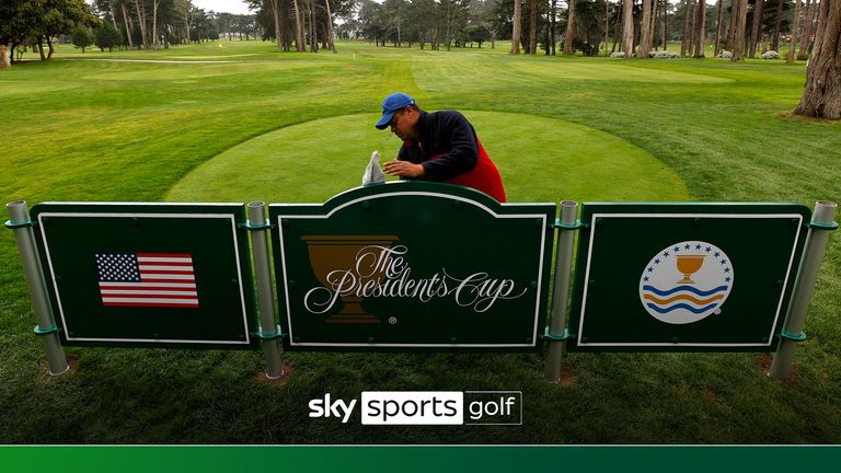 Edgar Banos puts the finishing touches on a display behind the 6th tee at Harding Park Golf Course on Wednesday September 23, 2009, the site for the 2009 Presidents Cup golf tournament, in San Francisco, Calif. (Michael Macor/San Francisco Chronicle via AP)


